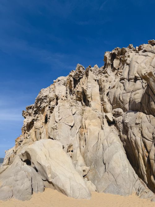 Free Explore the unique rock formations against a vibrant blue sky in Cabo San Lucas. Stock Photo