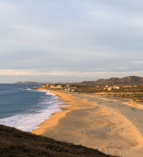Free A breathtaking sunset view of La Paz Beach, capturing the golden sands and tranquil waters of Baja California Sur, Mexico. Stock Photo