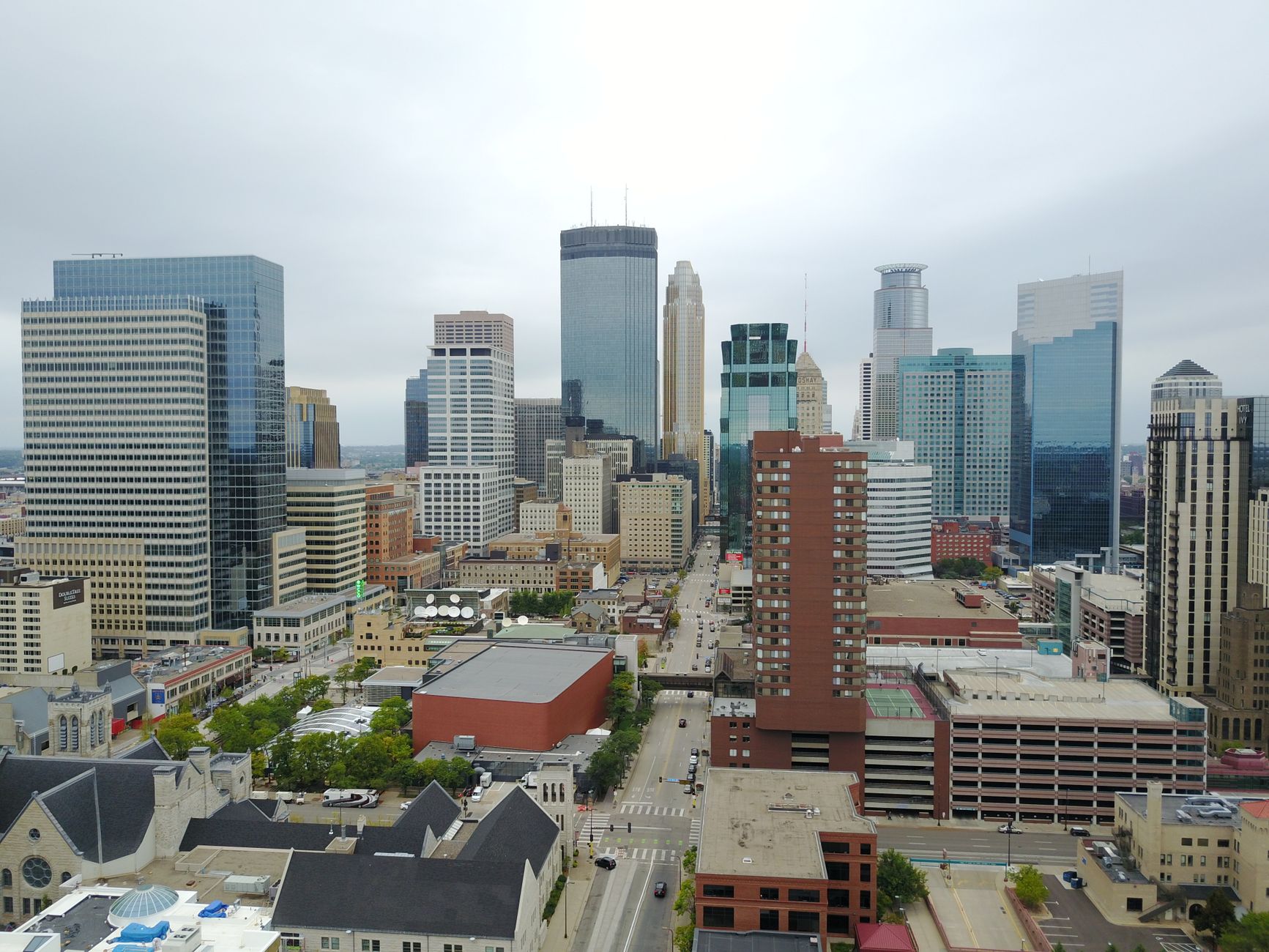 Stunning aerial view of downtown Minneapolis showcasing modern skyscrapers and urban landscape.