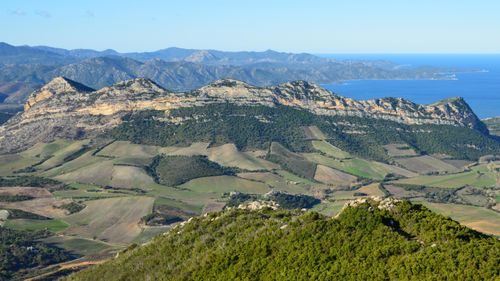Free Breathtaking aerial view of the mountain ranges near Saint-Florent, Corsica, France. Stock Photo