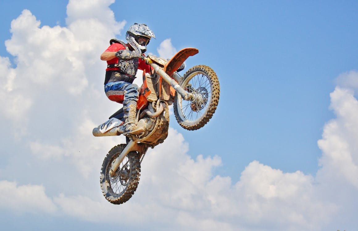 Free Man On A Motocross Dirt Bike Stock Photo