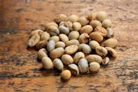 Raw Coffee Beans on Rustic Wooden Surface