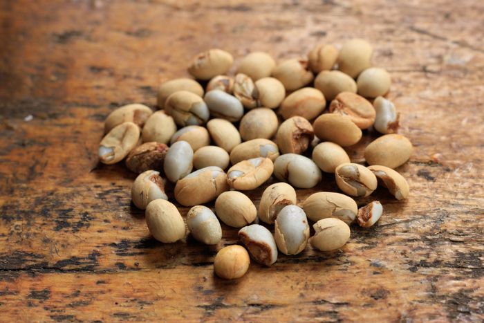 Green coffee beans on a wooden table