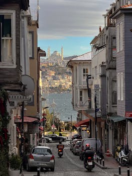 Picturesque street in Arnavutköy, Istanbul with a view of the majestic Bosphorus and cityscape.