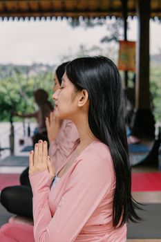 Serene yoga session outdoors in Jawa Barat, Indonesia, showcasing mindfulness and serenity.