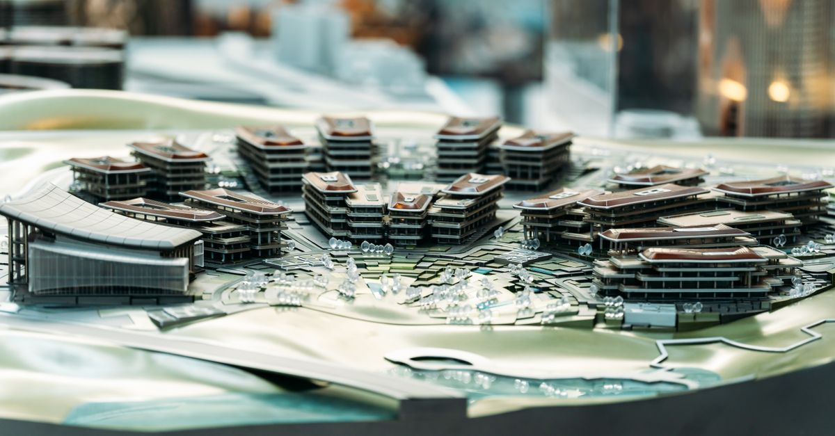 Detailed architectural model showcasing modern urban development with multiple buildings.
