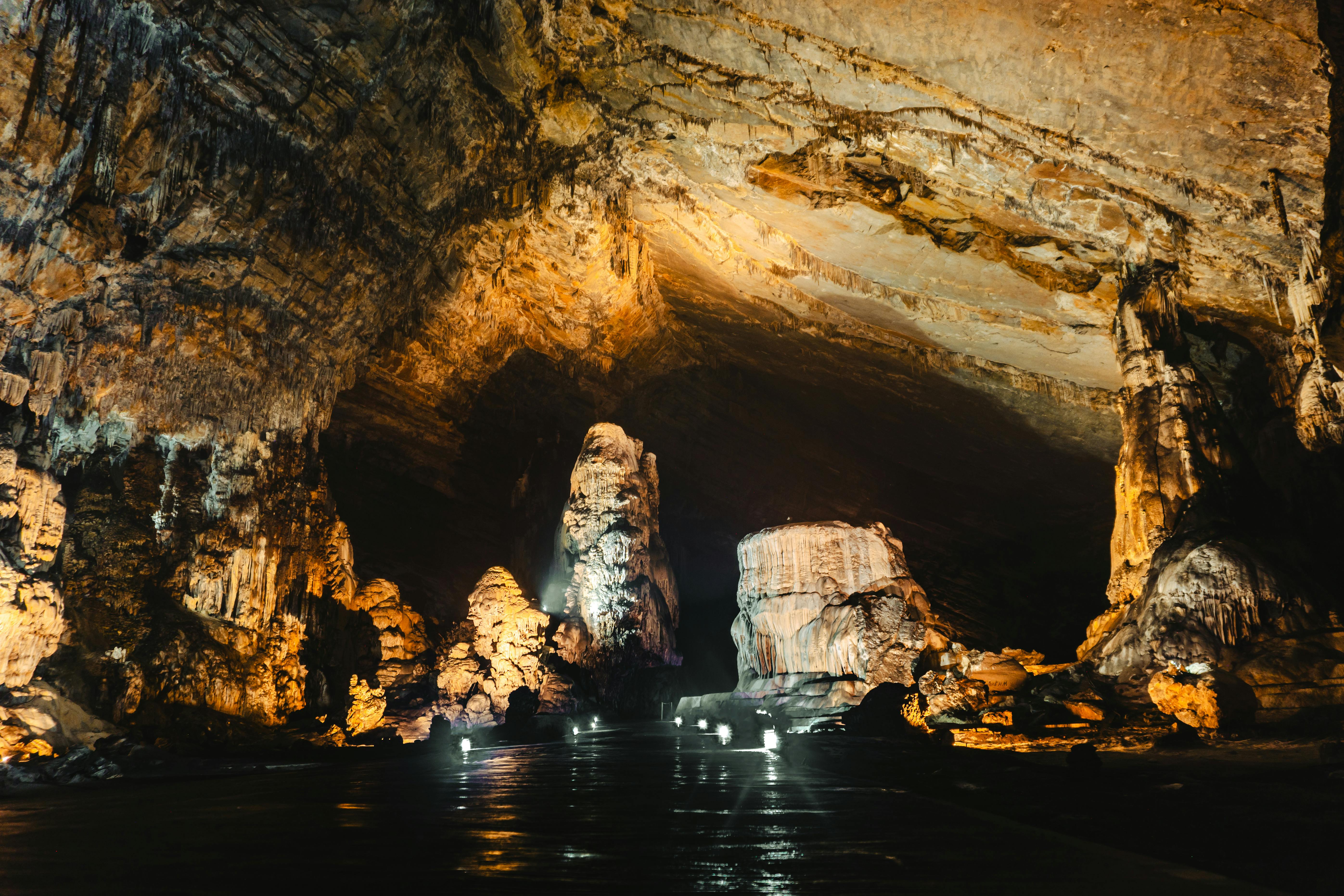 Reed Flute Cave illuminated limestone formations with colorful lighting and underground pools in Guilin Guangxi China