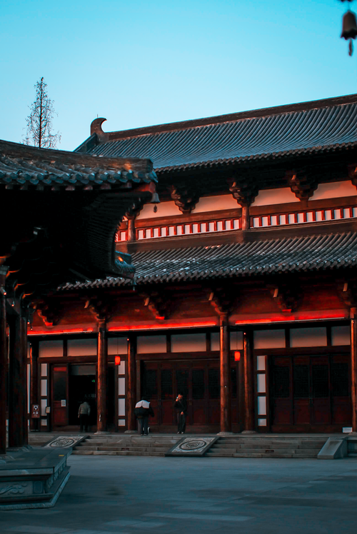 Free Elegant view of traditional Chinese architecture captured at twilight with a clear sky. Stock Photo
