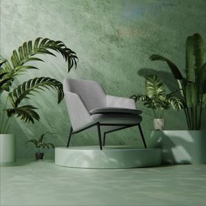 An armchair in a minimal green room — photo by Pușcaș Adryan on Pexels