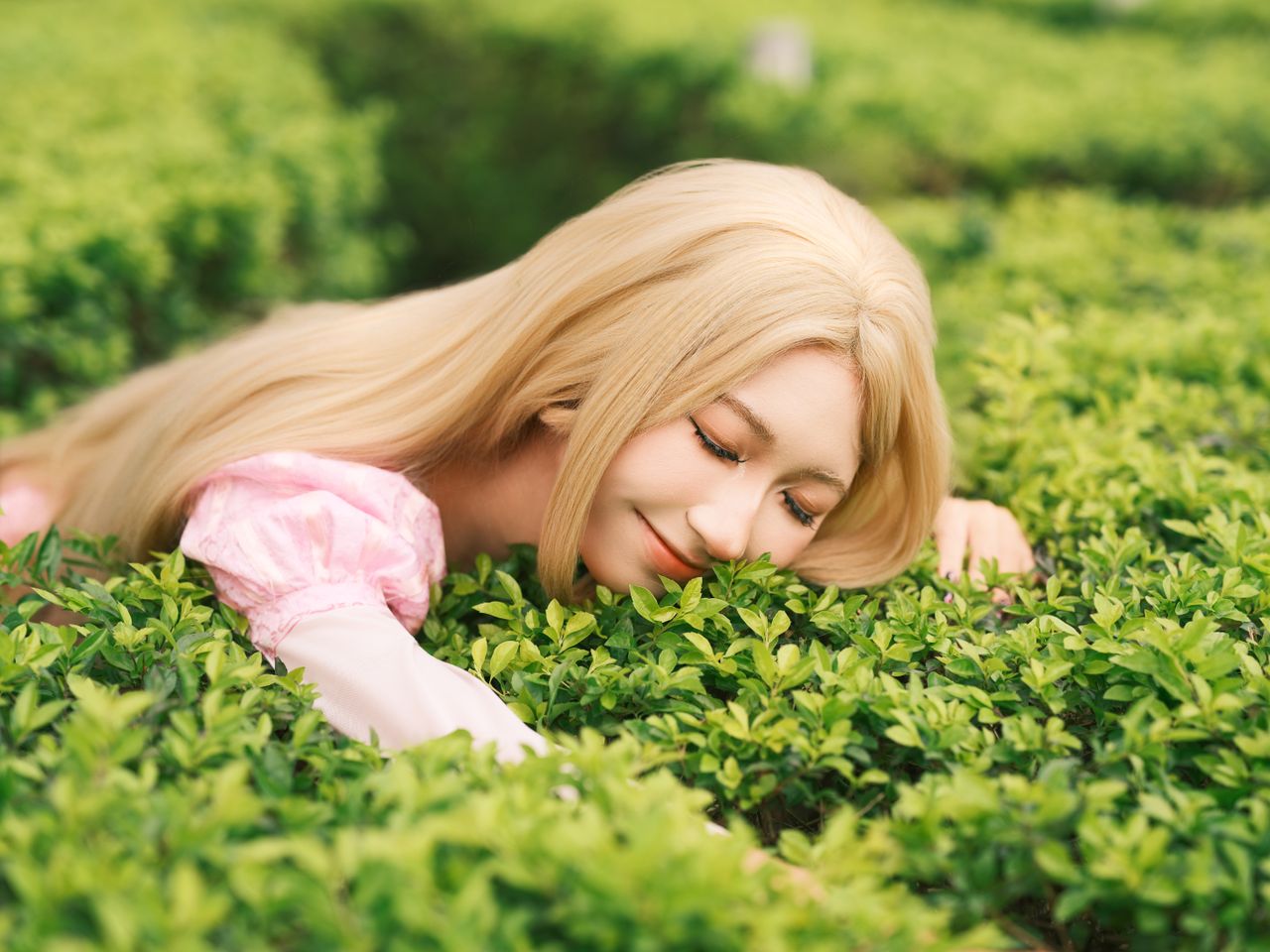 a serene moment with a young woman relaxing on lush greenery expressin