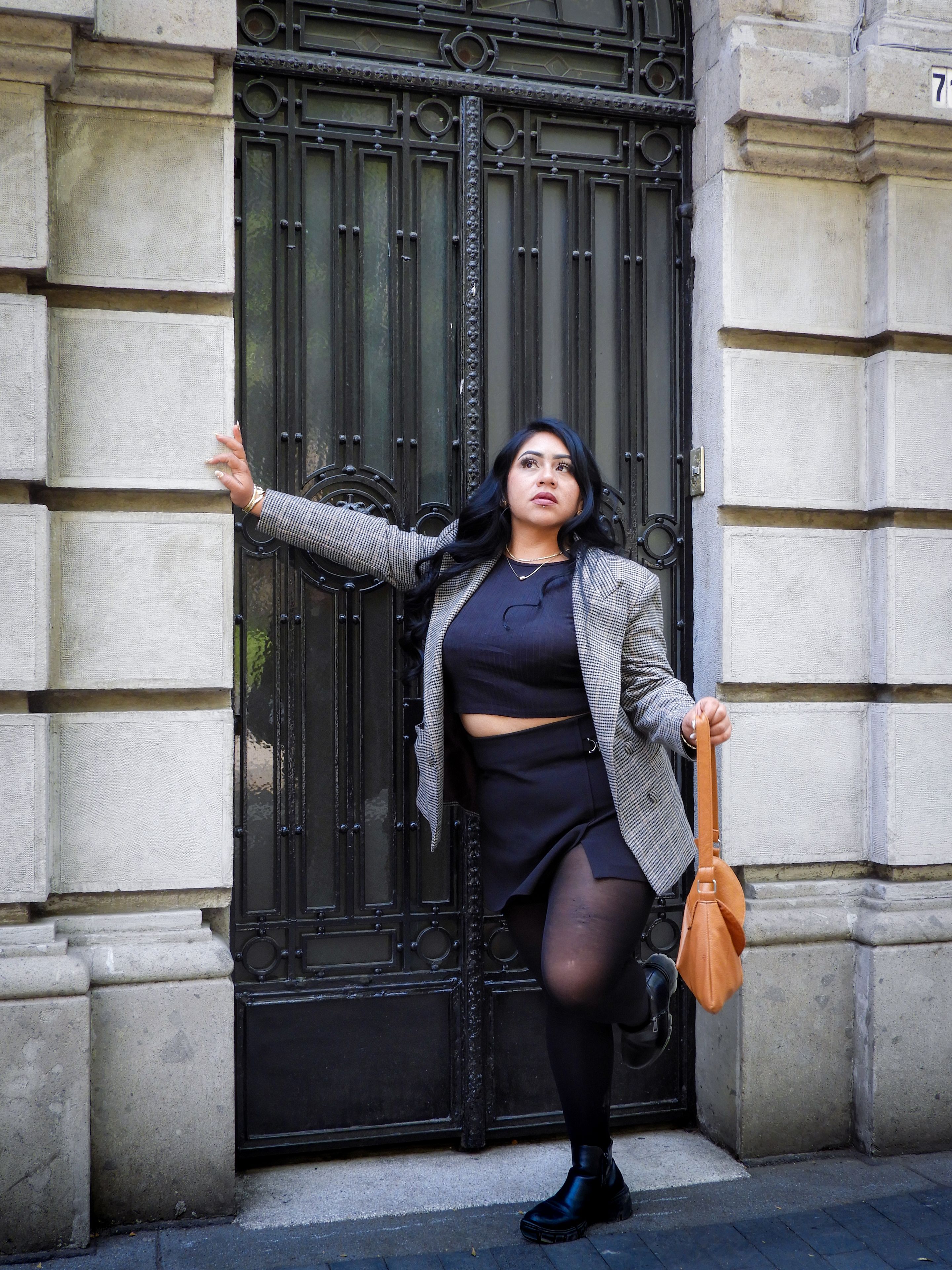 Stylish Woman Posing in Urban Setting · Free Stock Photo