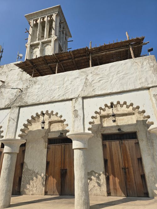 Free Historic architecture with wind tower in Dubai, featuring traditional design elements under clear blue skies. Stock Photo