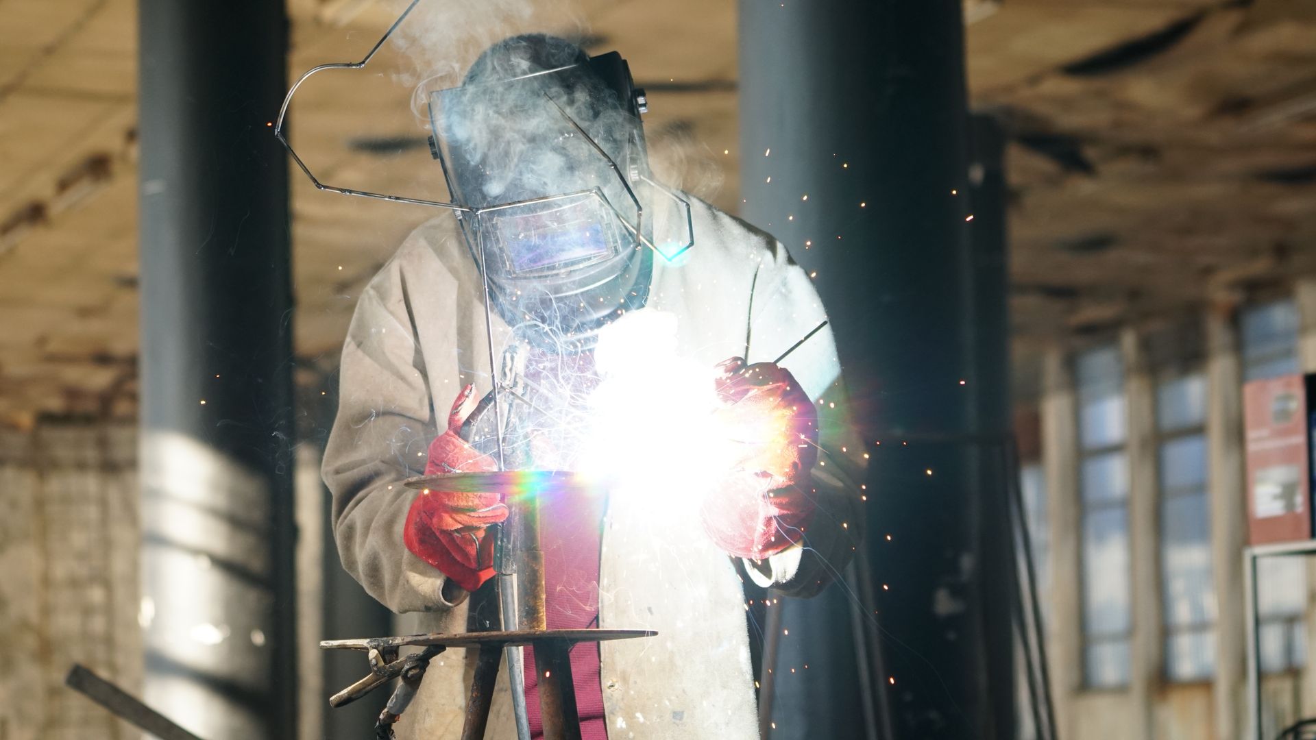 Standing welder joining steel with a bright arc