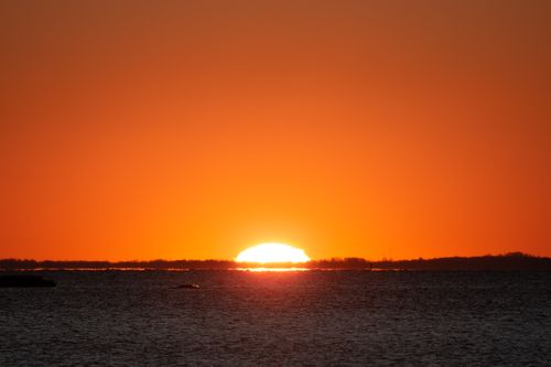 Free Stunning sunrise over water at Cove Island Park, Stamford, Connecticut. Stock Photo