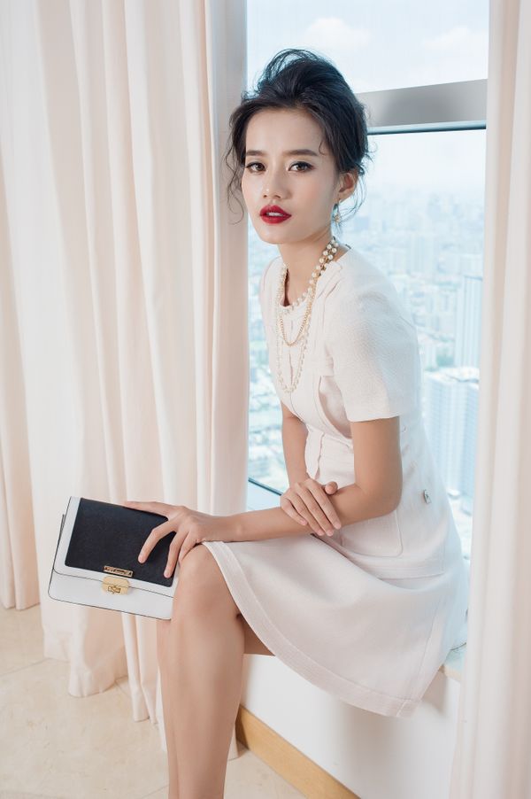 Woman in white shirt dress