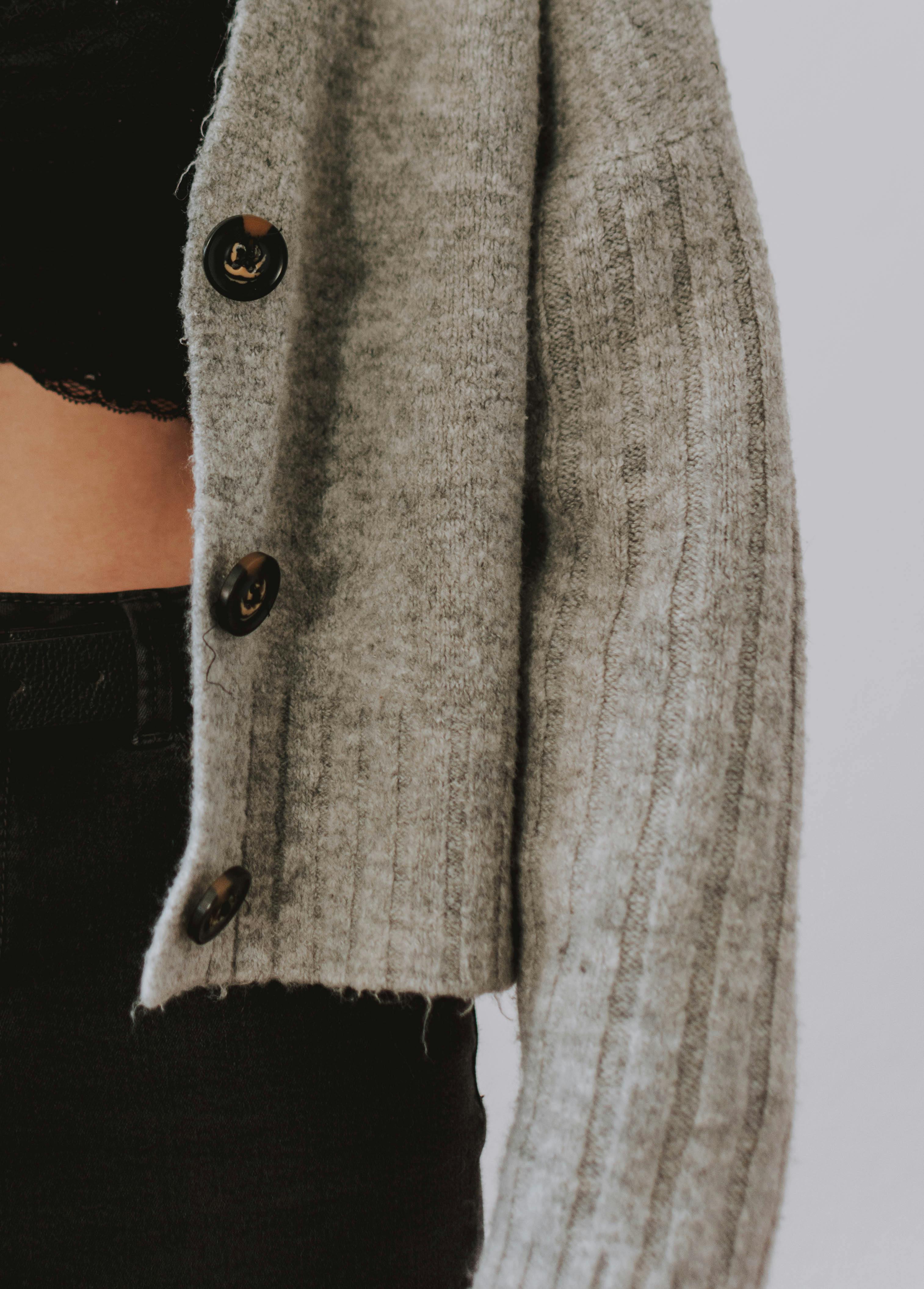 woman wearing gray button up wool sweater