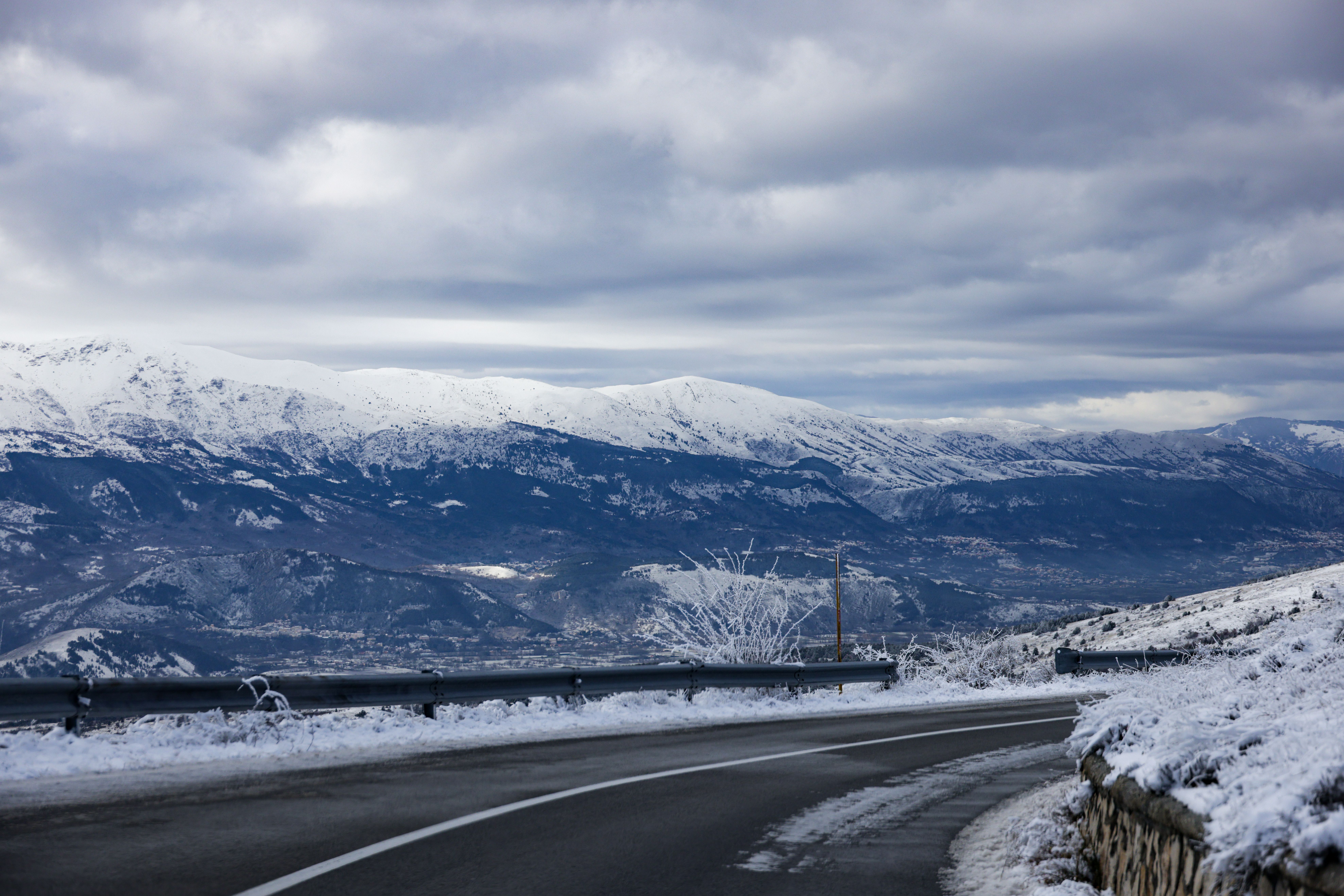 Scenic Snowy Mountain Road in Winter Landscape · Free Stock Photo