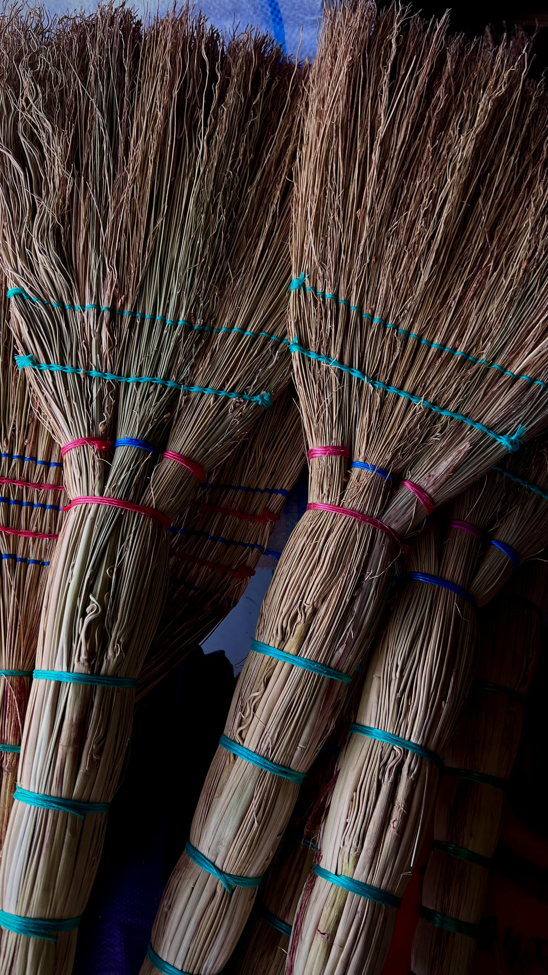 Close-up of traditional handmade brooms in Derbent, Russia, showcasing craftsmanship.