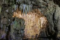 Explore the breathtaking formations of stalactites and stalagmites in this mysterious cave.