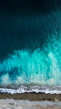 Stunning aerial shot of the Marmaris coastline with crashing waves and turquoise waters.