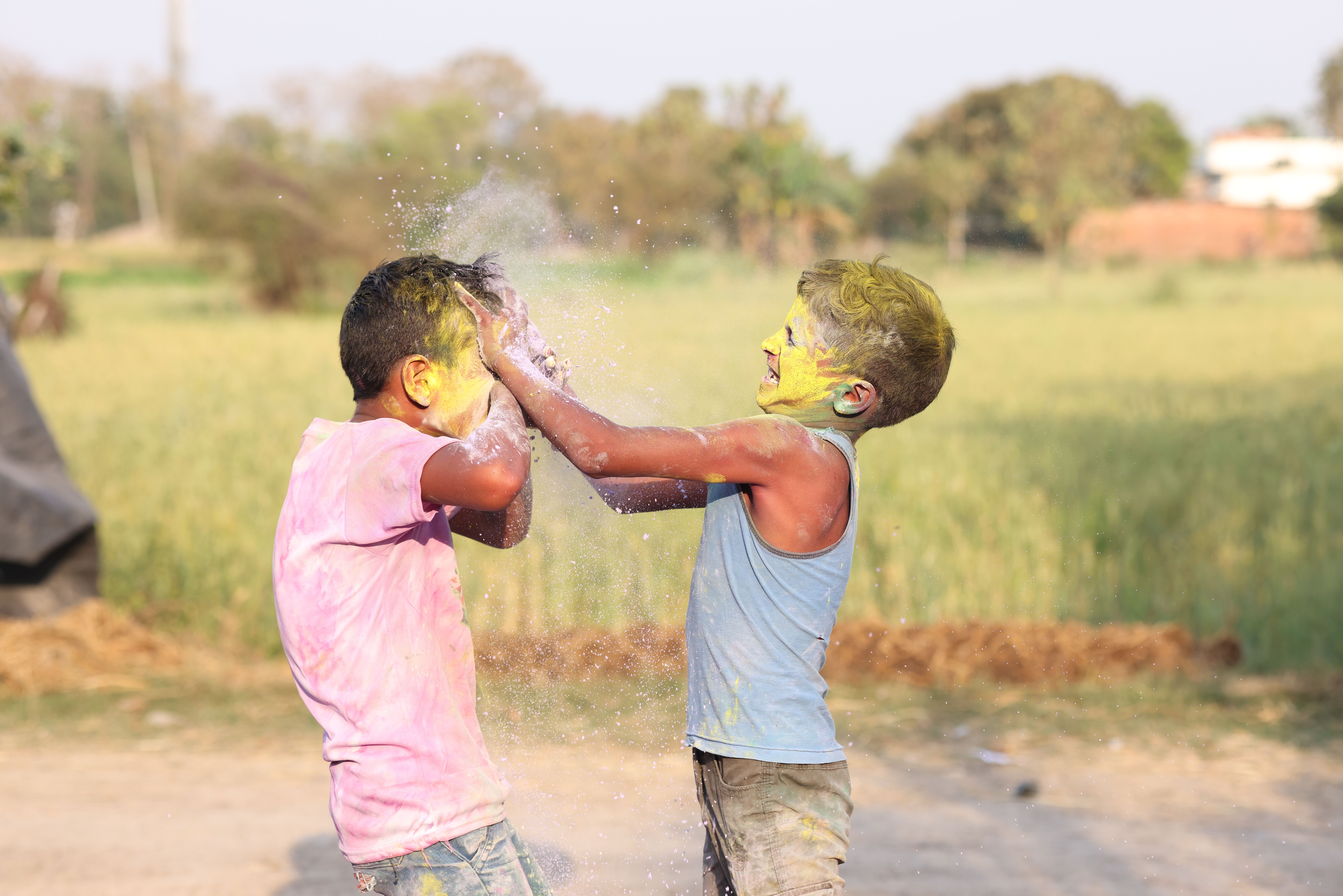 Children Playing with Colorful Powders Outdoors · Free Stock Photo