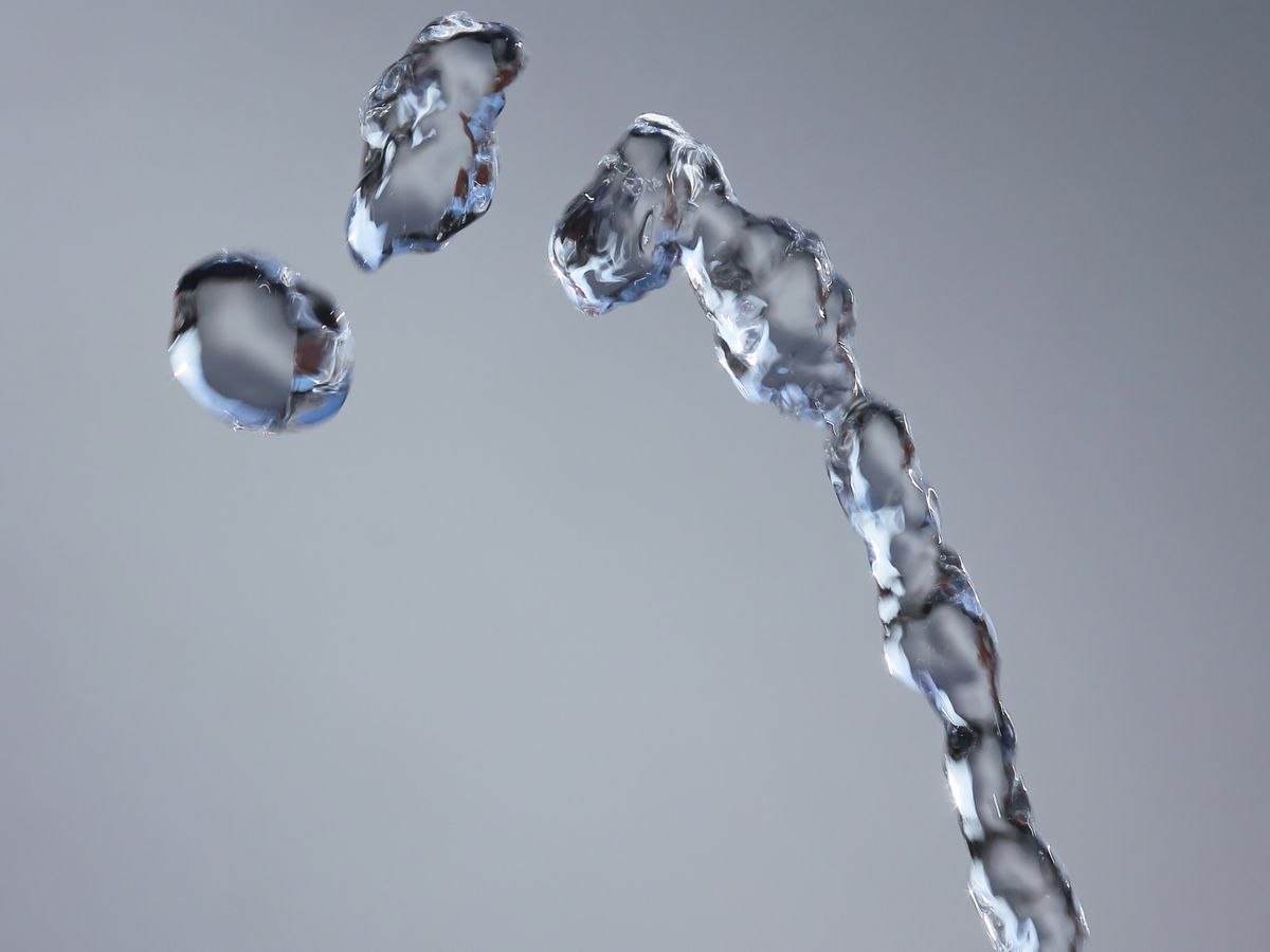 Water stream and droplets frozen in motion.