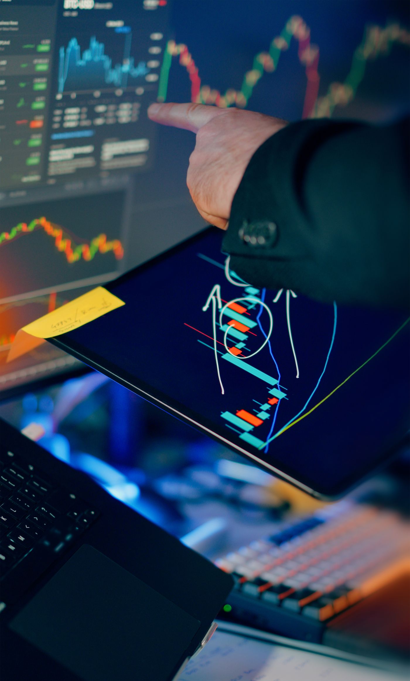Analyst reviewing structured credit performance data on multiple screens