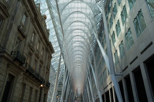 Free View of a striking indoor architectural design with glass skylight and columns. Stock Photo
