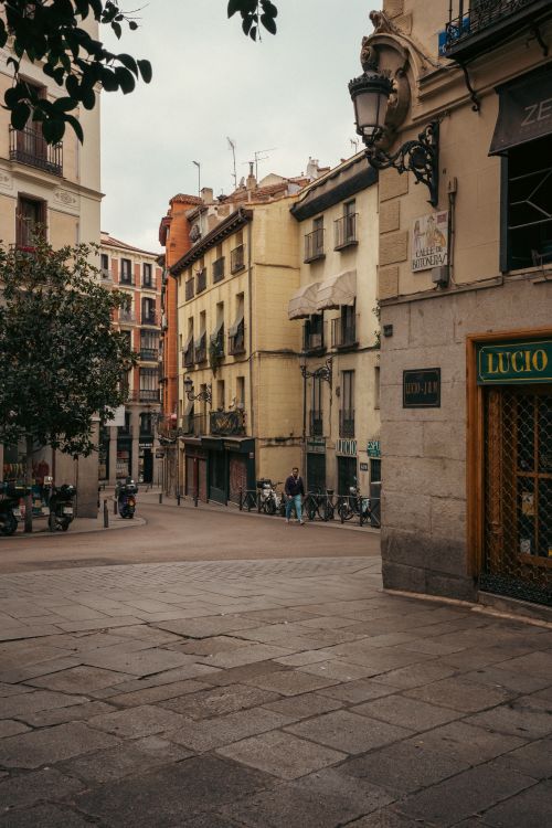Free Quaint European street with historic architecture and rustic charm. Stock Photo