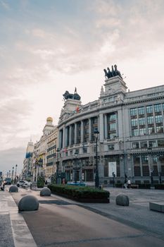 Captivating view of Gran Via, Madrid under a bright sky, showcasing classic architecture.