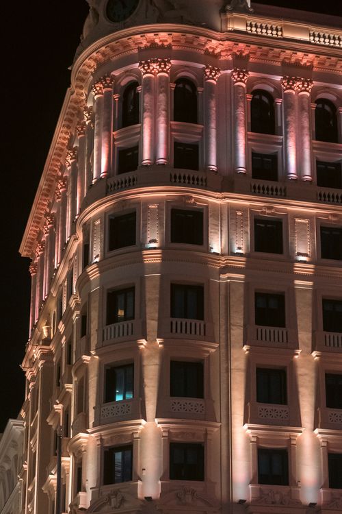 Free Stunning view of a beautifully illuminated building façade at night. Stock Photo