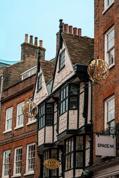 A vibrant street with historic architecture showcasing charming old buildings and festive decorations.