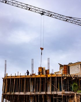 Building under construction with crane in Marrakesh, Morocco showcasing urban development.
