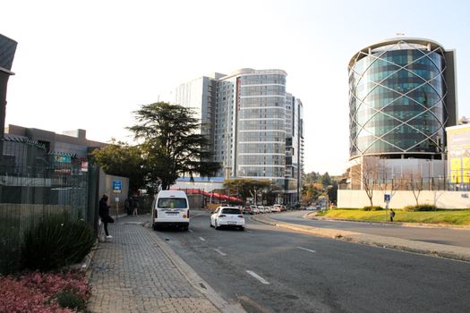 Elegant street view of modern buildings in Sandton, Gauteng, showcasing urban architecture.