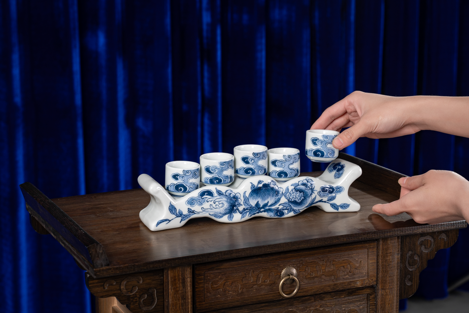 A glass of cloudy homemade rice wine served in a ceramic cup
