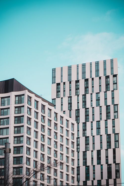 Free Contemporary high-rise residential buildings in Toronto with unique geometric patterns under a bright blue sky. Stock Photo
