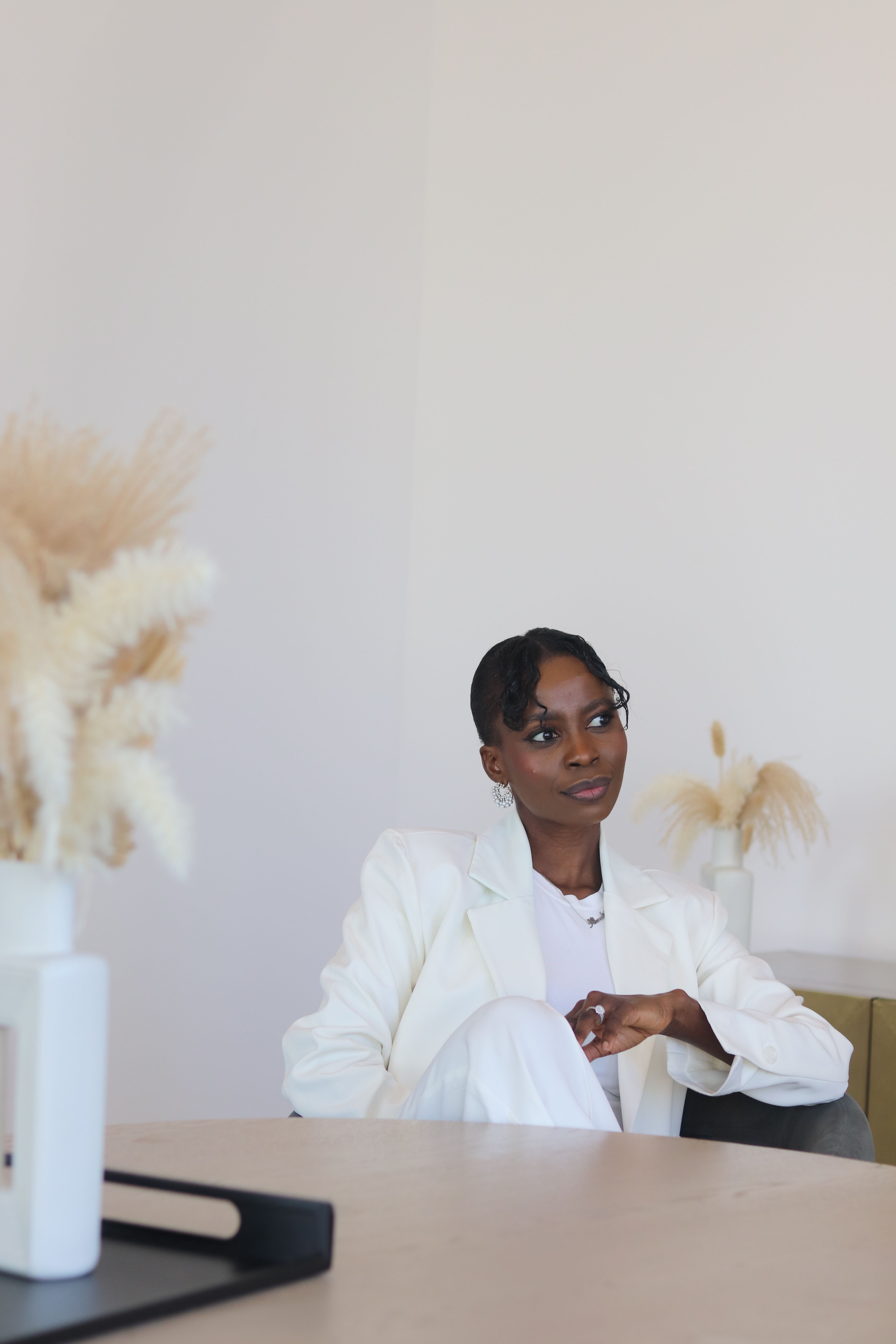 Elegant Woman in White Suit in Minimalist Interior · Free Stock Photo