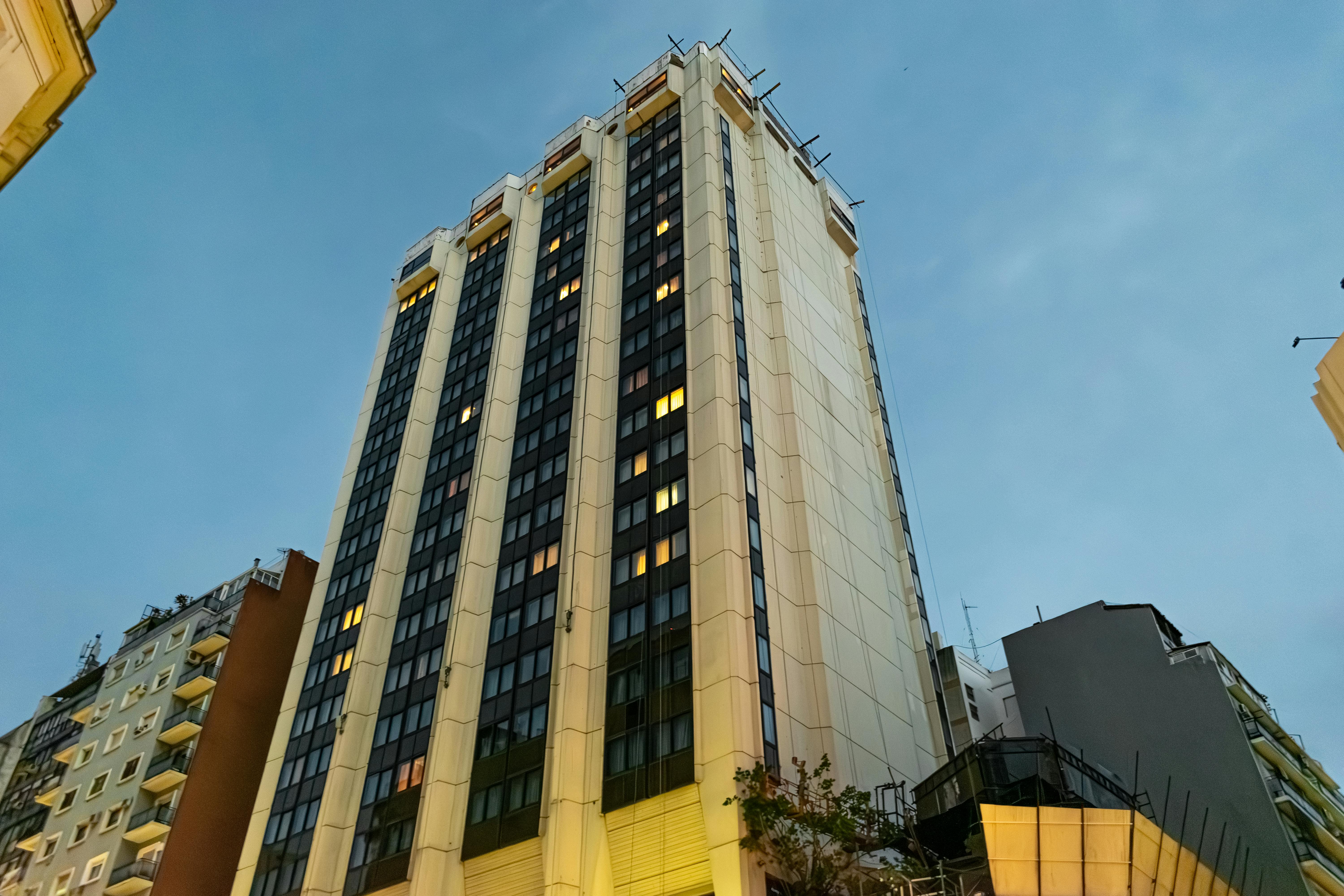 A tall building in Buenos Aires cityscape against a twilight sky