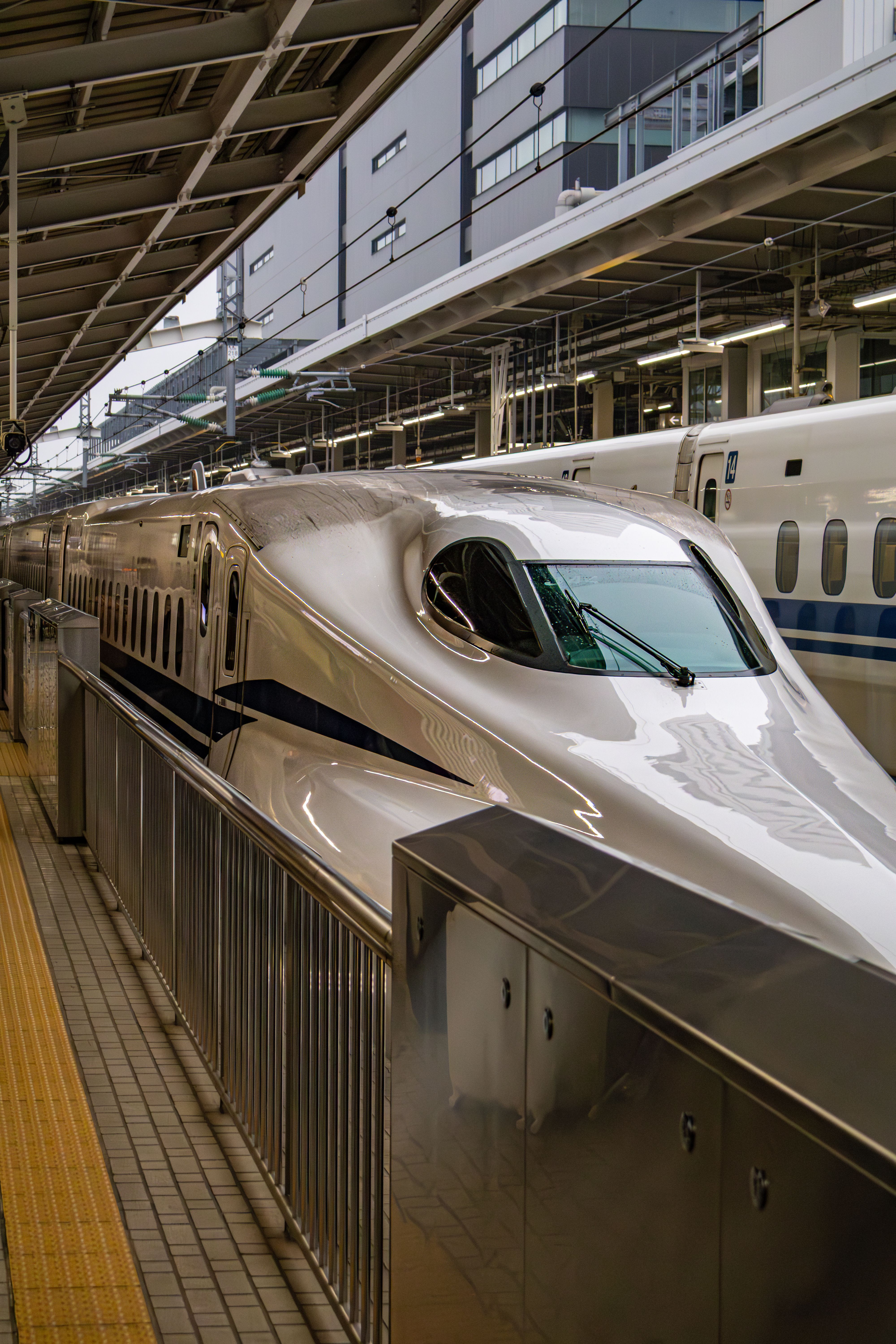A sleek Shinkansen bullet train stopped at Nagoya Station in Japan