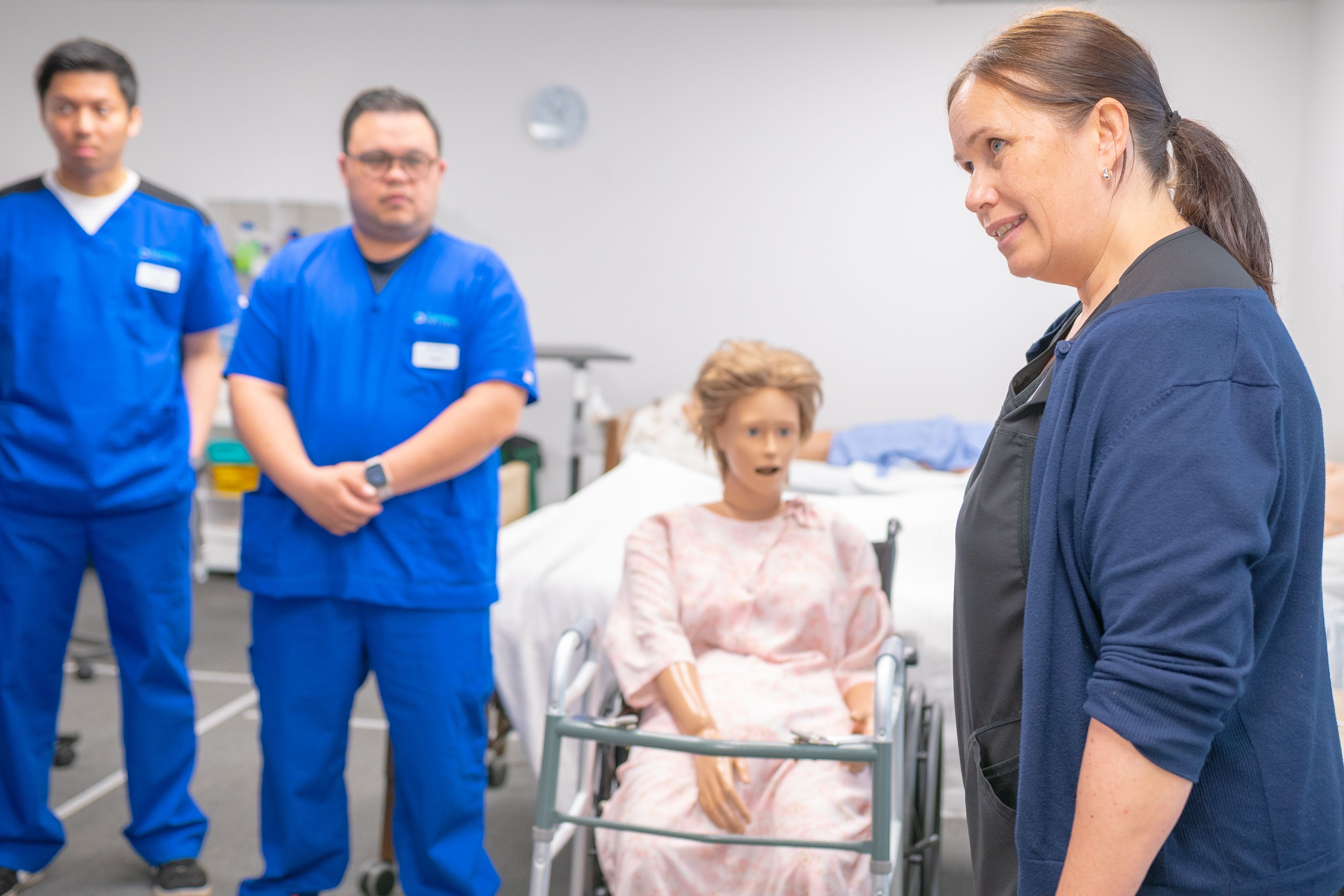 Nursing Students in Clinical Training with Mannequin · Free Stock Photo