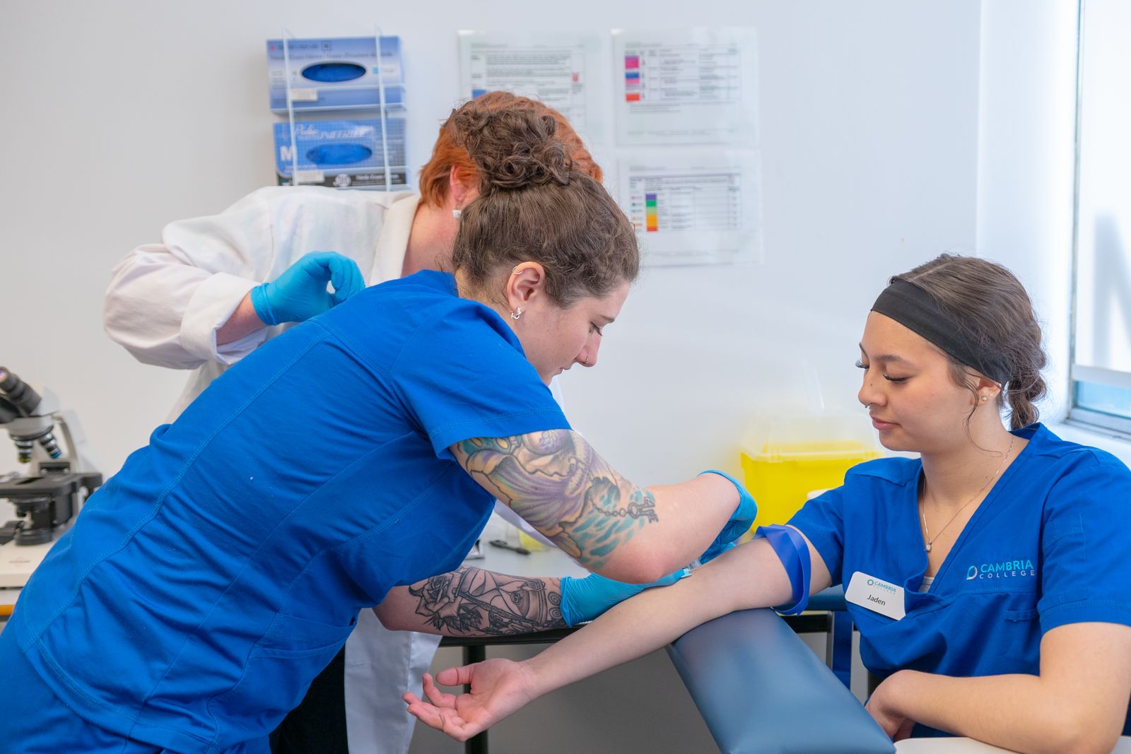 International nursing students practising clinical skills in a university simulation lab