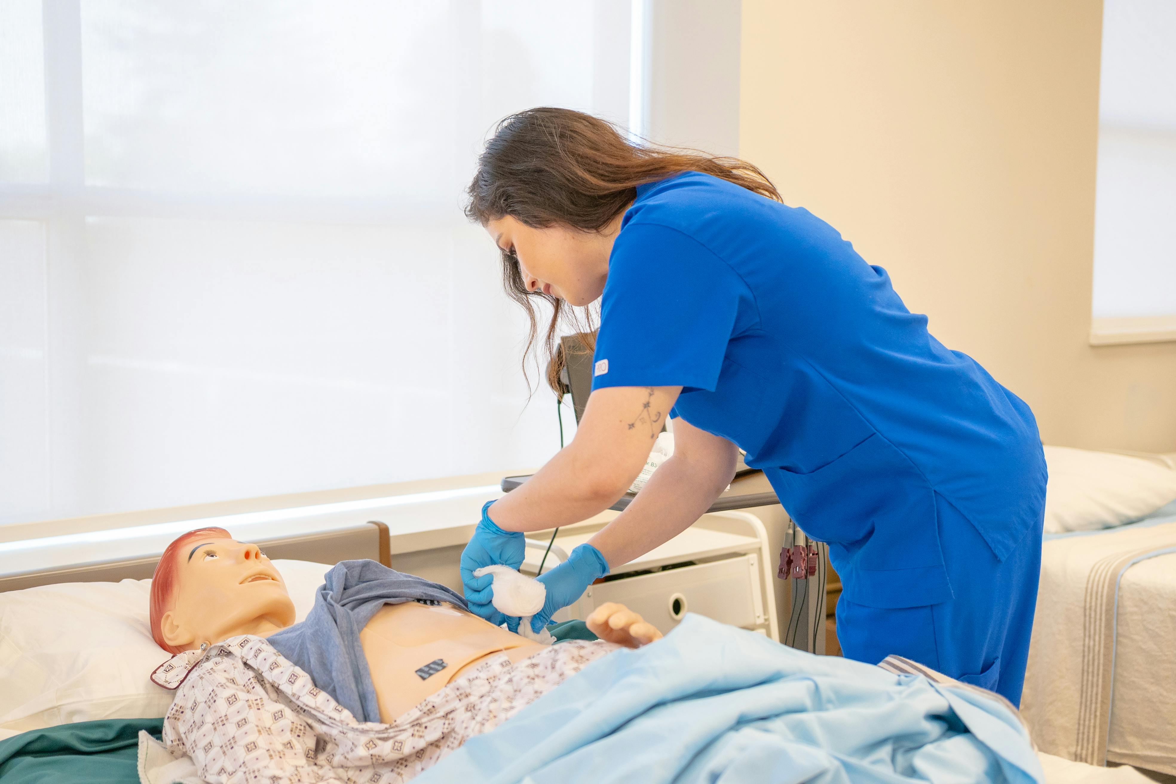 Nurse training with medical mannequin