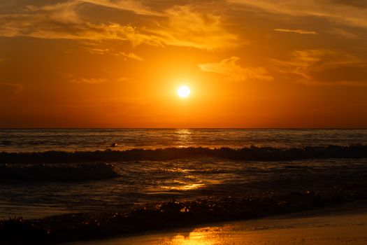 Capture the serene beauty of a golden hour beach sunset in El Salvador. Perfect for sunset lovers.