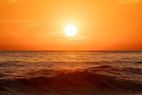 Free Stunning sunset view with vibrant orange hues over ocean waves in El Salvador, captured during golden hour. Stock Photo