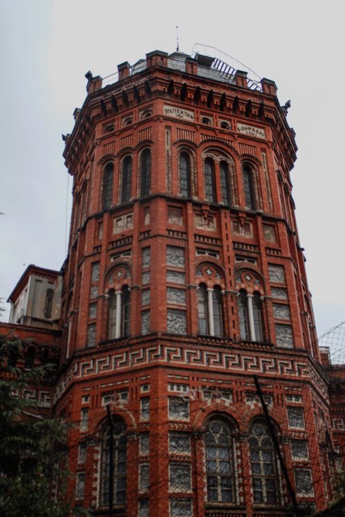 Free A stunning view of a historic red brick building in Istanbul, showcasing intricate architecture. Stock Photo