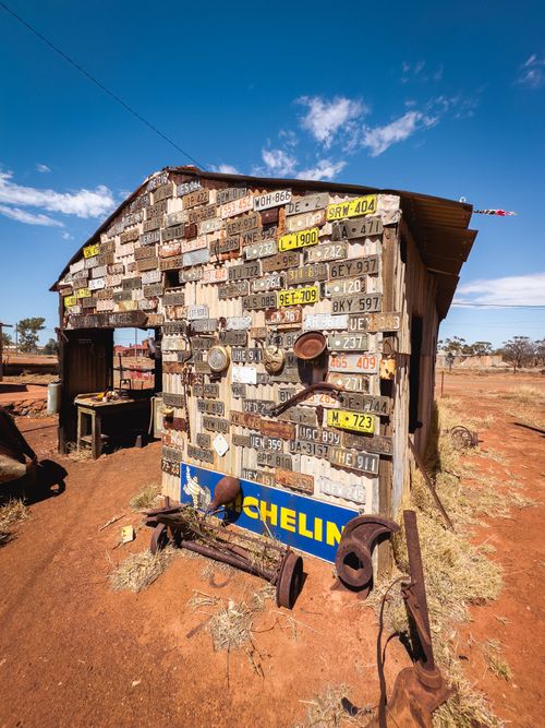 Free A unique shack adorned with vintage license plates in a remote Australian ghost town. Stock Photo