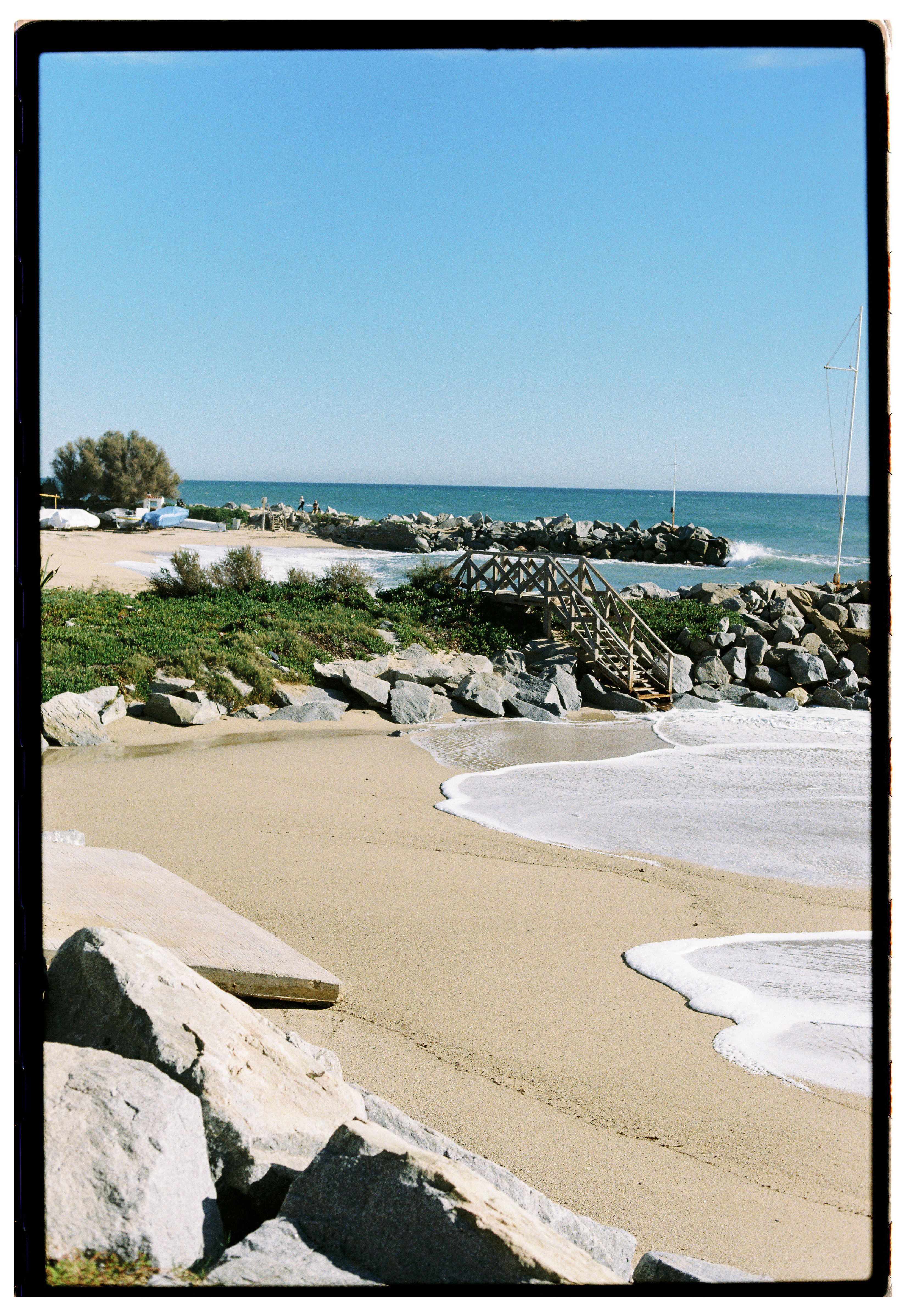 Scenic Coastal Beach with Rock Formations · Free Stock Photo