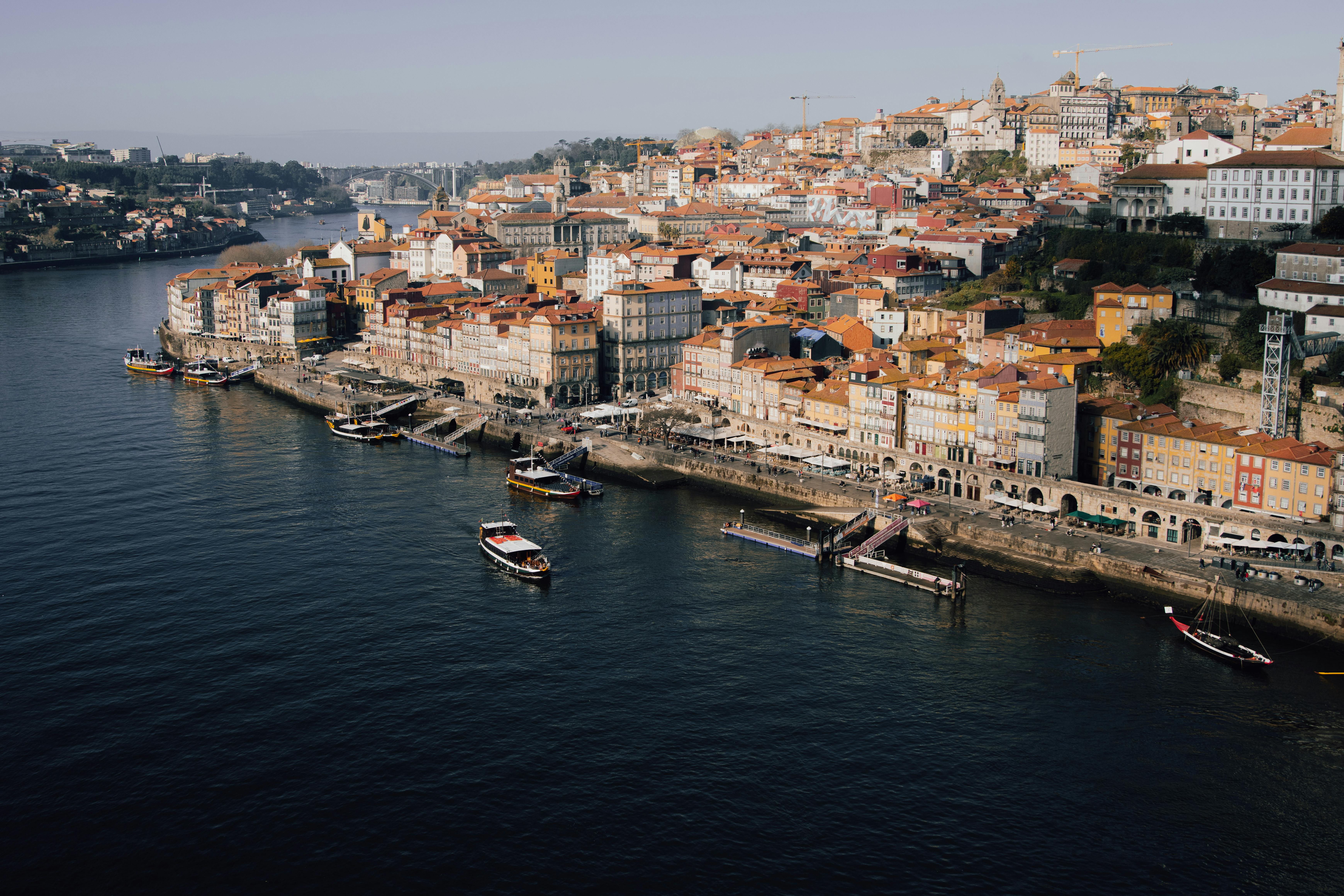 A stunning aerial view of Porto's historic riverside with colorful architecture along the Douro River.