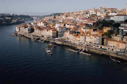 Free A stunning aerial view of Porto's historic riverside with colorful architecture along the Douro River. Stock Photo