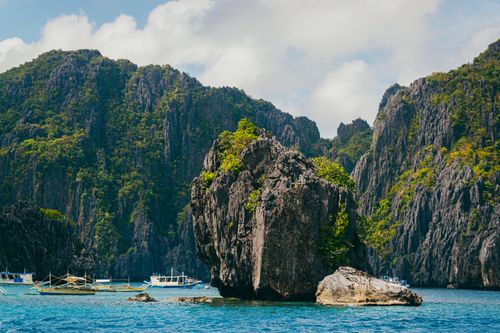 Free Stunning view of limestone cliffs and boats in El Nido, Palawan, Philippines. Stock Photo